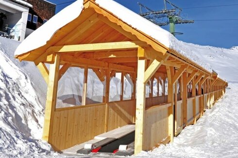 Impressive wooden galleries for Sunkid Moving Carpet conveyor belts in Serfaus, Fiss and the